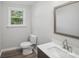 Renovated bathroom featuring modern vanity and fixtures, with wood-look flooring at 2679 Providence Mill Rd, Maiden, NC 28650