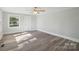 Bright bedroom with modern flooring, fresh paint and a large window at 2679 Providence Mill Rd, Maiden, NC 28650