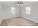 Light-filled bedroom with modern ceiling fan and attractive wood-look flooring at 2679 Providence Mill Rd, Maiden, NC 28650