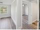 Bright bedroom showcasing hardwood flooring, fresh paint, and view to the next room at 2679 Providence Mill Rd, Maiden, NC 28650