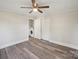 Neutral bedroom featuring hardwood flooring, a closet, and access to laundry area at 2679 Providence Mill Rd, Maiden, NC 28650