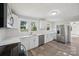 Bright kitchen features white cabinets, new appliances, and countertops at 2679 Providence Mill Rd, Maiden, NC 28650
