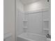 Bright white bathroom featuring tub and shower combination with built-in shelving at 277 Supernova Dr, York, SC 29745