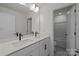 A bathroom features double sinks and black hardware at 277 Supernova Dr, York, SC 29745