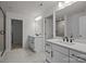 A bright, modern bathroom features double sinks, and a glass door shower at 277 Supernova Dr, York, SC 29745