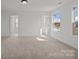 A carpeted bedroom with two windows at 277 Supernova Dr, York, SC 29745