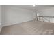 Large bonus room with neutral carpet, stairs, and railing at 277 Supernova Dr, York, SC 29745