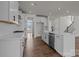 Spacious open kitchen featuring white cabinetry, a large island, and hardwood floors at 277 Supernova Dr, York, SC 29745