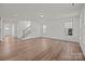 Spacious living room featuring hardwood floors, a staircase, and natural light at 277 Supernova Dr, York, SC 29745
