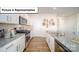 Well-lit kitchen featuring stainless steel appliances, granite countertops, and white cabinetry at 3023 Sassafras Trl, Gastonia, NC 28056