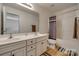 Well-lit bathroom with double vanity, large mirror, and shower-tub combination at 3040 Sunshower Hts, York, SC 29745
