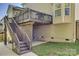 Exterior view of a house with a large deck and a staircase leading to the backyard at 3040 Sunshower Hts, York, SC 29745