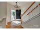 Bright foyer features a hardwood floor, staircase, and updated lighting fixture at 3040 Sunshower Hts, York, SC 29745