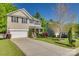 Charming two-story home with a well-manicured lawn, inviting porch, and a two-car garage at 3040 Sunshower Hts, York, SC 29745