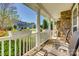Inviting front porch with chairs and charming flower boxes on the white railing at 3040 Sunshower Hts, York, SC 29745