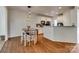 Eat-in kitchen has white cabinets, modern pendant lighting, and stainless steel appliances at 3040 Sunshower Hts, York, SC 29745