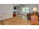 Comfortable living room with wood flooring, ceiling fan, large window, and ample space for furniture at 3040 Sunshower Hts, York, SC 29745