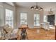 Cozy living room adjacent to the foyer with hardwood floors and natural light at 3040 Sunshower Hts, York, SC 29745