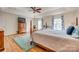 Large main bedroom with hardwood floors, ceiling fan, tray ceiling, area rug, and natural light at 3040 Sunshower Hts, York, SC 29745