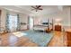 Spacious main bedroom features a tray ceiling, wood floors, large windows, and a decorative rug at 3040 Sunshower Hts, York, SC 29745