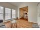 Sunroom with large windows and a cozy seating area, open to the kitchen and dining room at 3040 Sunshower Hts, York, SC 29745
