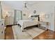 Comfortable bedroom featuring hardwood floors, neutral walls, an area rug, and coordinating decor at 3324 Champaign St, Charlotte, NC 28210