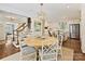 Dining area with modern table and stairs to a gourmet kitchen at 3324 Champaign St, Charlotte, NC 28210