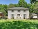 Stunning two-story home with a beautiful lawn and mature trees at 3324 Champaign St, Charlotte, NC 28210