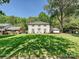 Charming white brick two-story home with shutters and manicured lawn at 3324 Champaign St, Charlotte, NC 28210