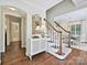 Welcoming foyer with hardwood floors, staircase, and stylish decor at 3324 Champaign St, Charlotte, NC 28210