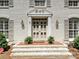 Close up of the front door with brick steps and classic features at 3324 Champaign St, Charlotte, NC 28210