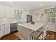 Bright kitchen features a large island, stainless steel appliances, and stylish window treatments at 3324 Champaign St, Charlotte, NC 28210