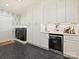 Well-equipped laundry room with stylish cabinetry, modern appliances, and a chic beverage center at 3324 Champaign St, Charlotte, NC 28210