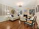 Charming living room featuring a fireplace, built-in shelving, and elegant decor at 3324 Champaign St, Charlotte, NC 28210