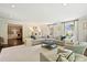 Large living room featuring ample seating, a decorative ottoman, and plenty of natural light at 3324 Champaign St, Charlotte, NC 28210