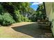 Expansive backyard with plenty of green space and mature trees, great for outdoor activities at 3423 Archer Ave, Charlotte, NC 28217