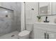 Updated bathroom featuring a sleek vanity and a modern tiled shower at 3423 Archer Ave, Charlotte, NC 28217