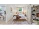 Bright bedroom with neutral tones, stylish rug, and decoratively placed shelves adding a charming aesthetic at 3423 Archer Ave, Charlotte, NC 28217