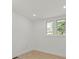 Bright bedroom with hardwood floor and double windows at 3423 Archer Ave, Charlotte, NC 28217