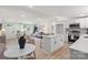 Bright, open floor plan connecting the kitchen, living room, and dining area creating seamless flow at 3423 Archer Ave, Charlotte, NC 28217