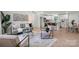 Open-concept living area with modern decor, connecting kitchen, living, and dining spaces at 3423 Archer Ave, Charlotte, NC 28217