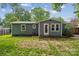 The back exterior reveals a home with siding, a door and window at 3725 Dunwoody Dr, Charlotte, NC 28215