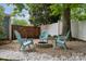 Backyard with a fire pit and three chairs at 3725 Dunwoody Dr, Charlotte, NC 28215