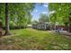Backyard with lawn and fire pit at 3725 Dunwoody Dr, Charlotte, NC 28215