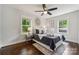 Bedroom with a tray and vase placed on the bed, ceiling fan and natural light from the windows at 3725 Dunwoody Dr, Charlotte, NC 28215