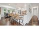 Modern kitchen with white cabinets, granite countertops, stainless steel appliances and bar stool seating at 3725 Dunwoody Dr, Charlotte, NC 28215