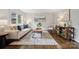 Bright living room boasts hardwood floors, a large window, comfortable seating and modern decor at 3725 Dunwoody Dr, Charlotte, NC 28215