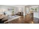 Open-concept living room showcases hardwood floors, modern decor, and seamless flow to the kitchen at 3725 Dunwoody Dr, Charlotte, NC 28215