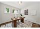 Home office with a modern desk, stylish rug, and natural light from the windows at 3725 Dunwoody Dr, Charlotte, NC 28215
