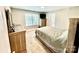 Bedroom with carpeted floor, tan walls, and neutral-colored decor at 4476 River Rd, Stanfield, NC 28163